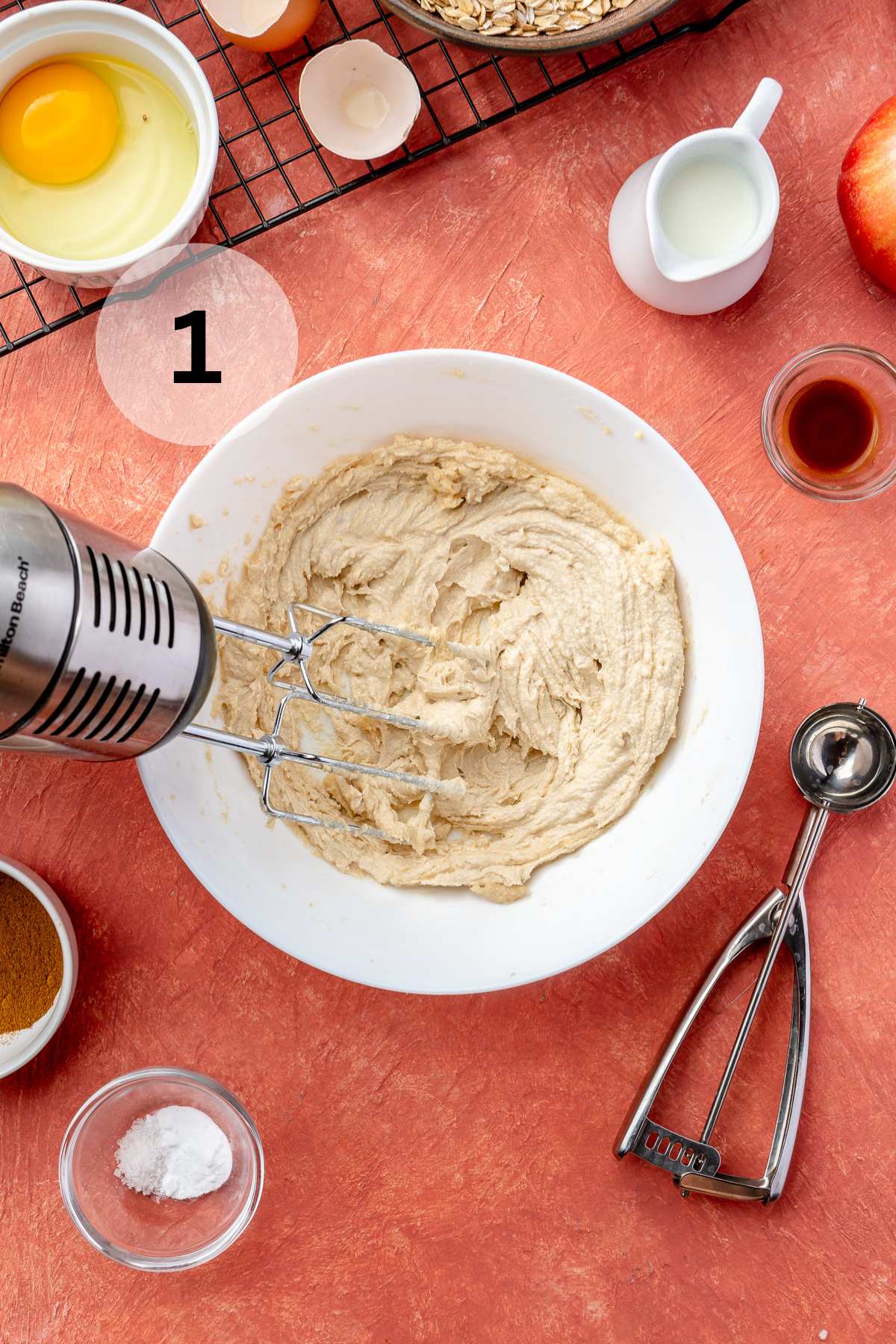 Creaming butter, brown sugar, and granulated sugar together.