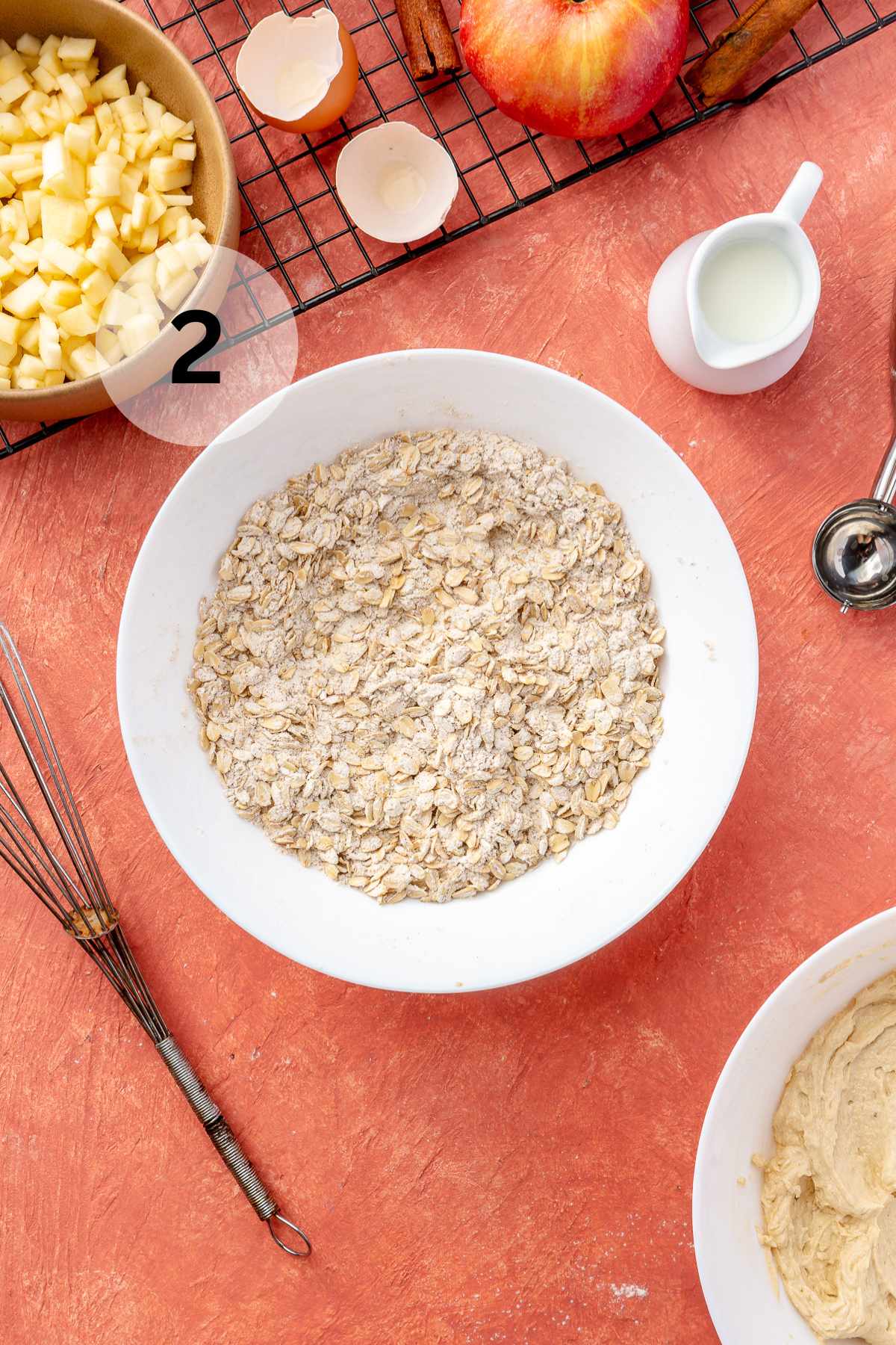 Mixing flour with cinnamon, baking soda, salt and oats.