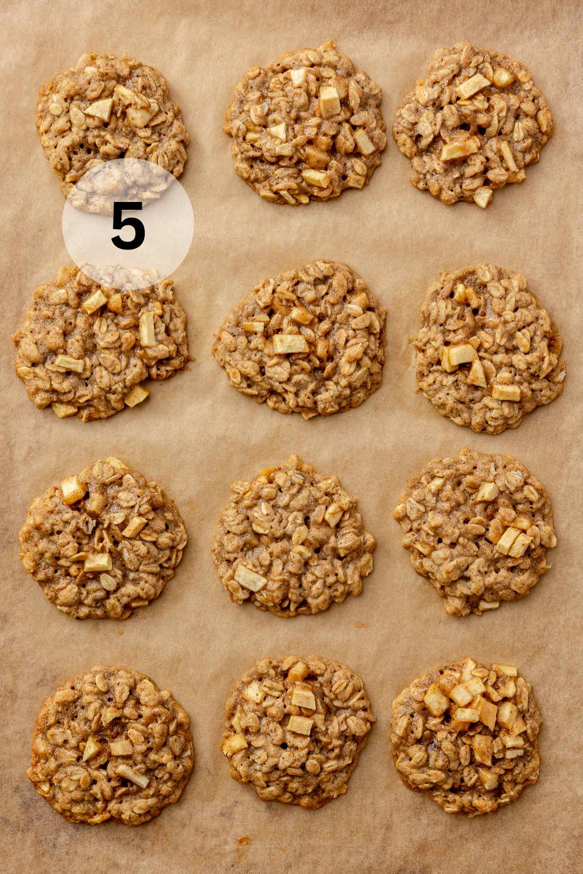 Apple oatmeal cookies on parchment paper.