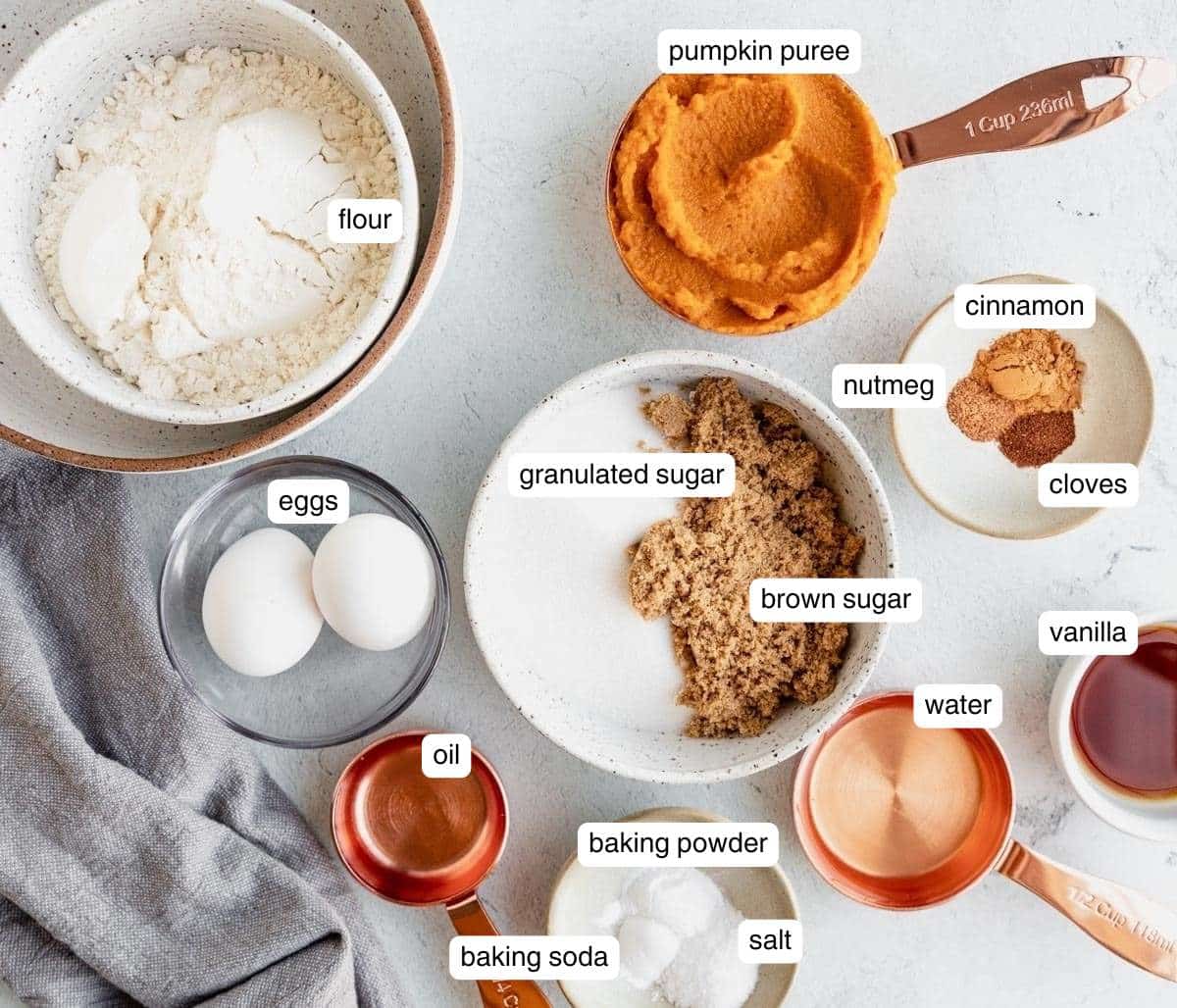 Flour, sugar, pumpkin puree, eggs and spices all divided into portions.