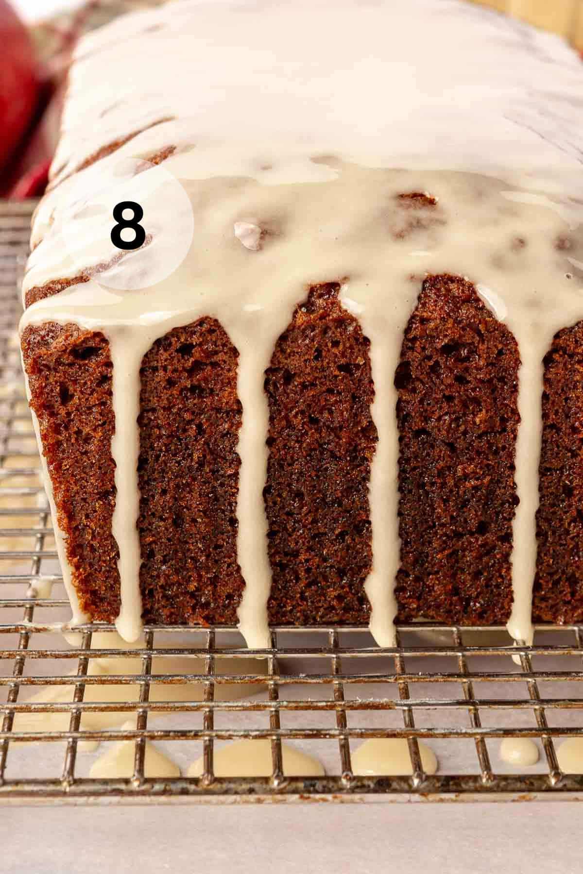 Glaze drizzled over applesauce bread.