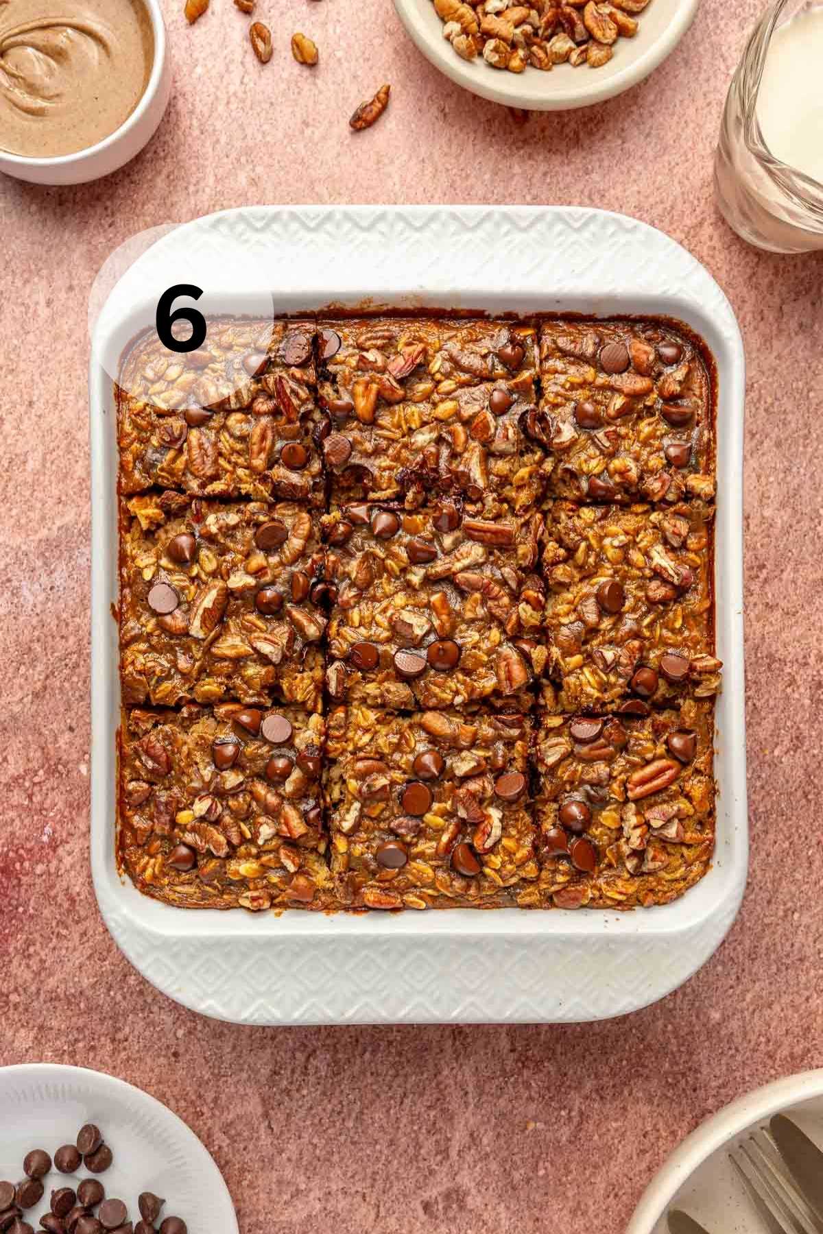 Baked oatmeal cut into 6 servings in a white baking dish.
