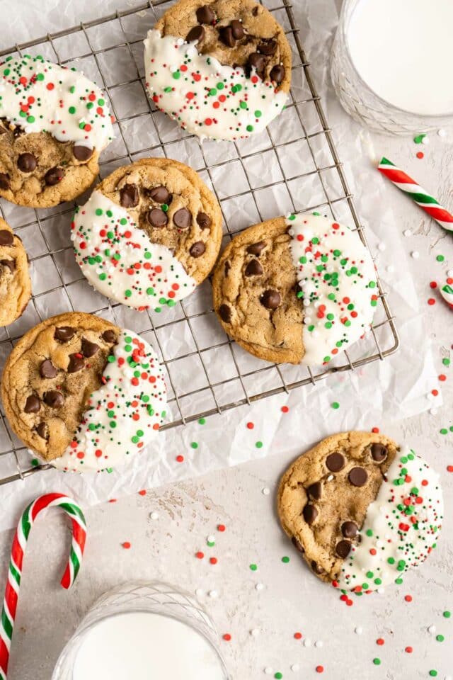Chocolate chip cookies dipped in white chocolate  with sprinkles.