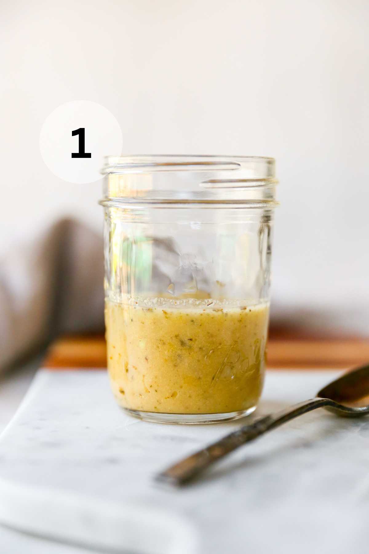 Italian dressing whisked together in a small mason jar.