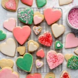 Heart shaped sugar cookies with icing and sprinkles.