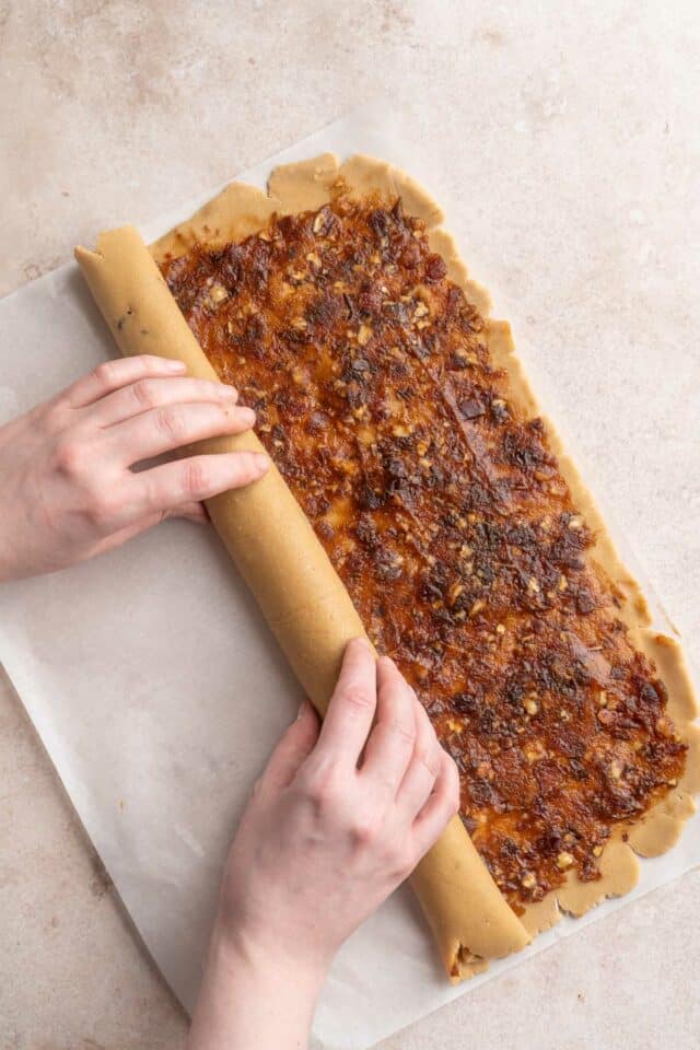Rolling dough into a log.