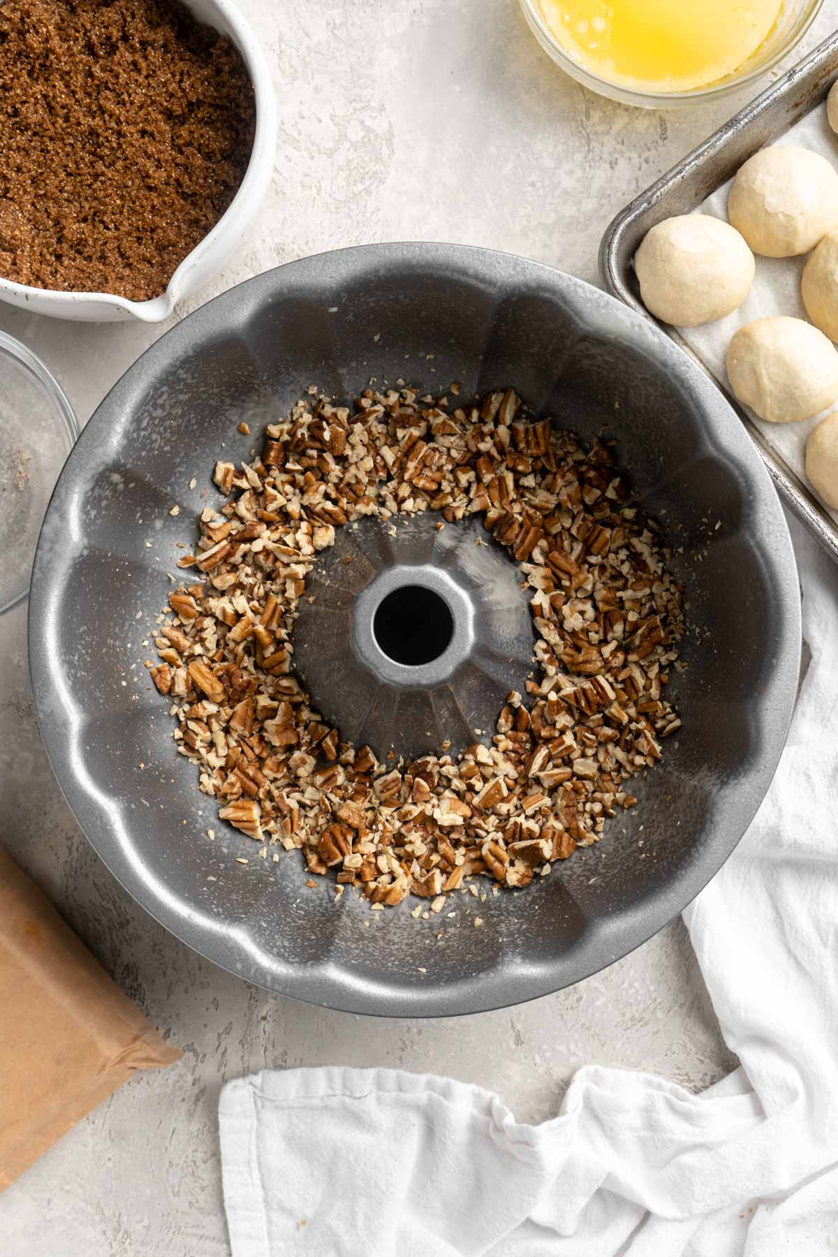 Chopped pecans in a bundt pan.