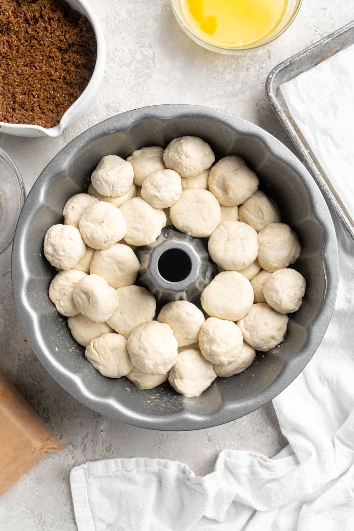 Frozen dinner rolls in a bundt pan.