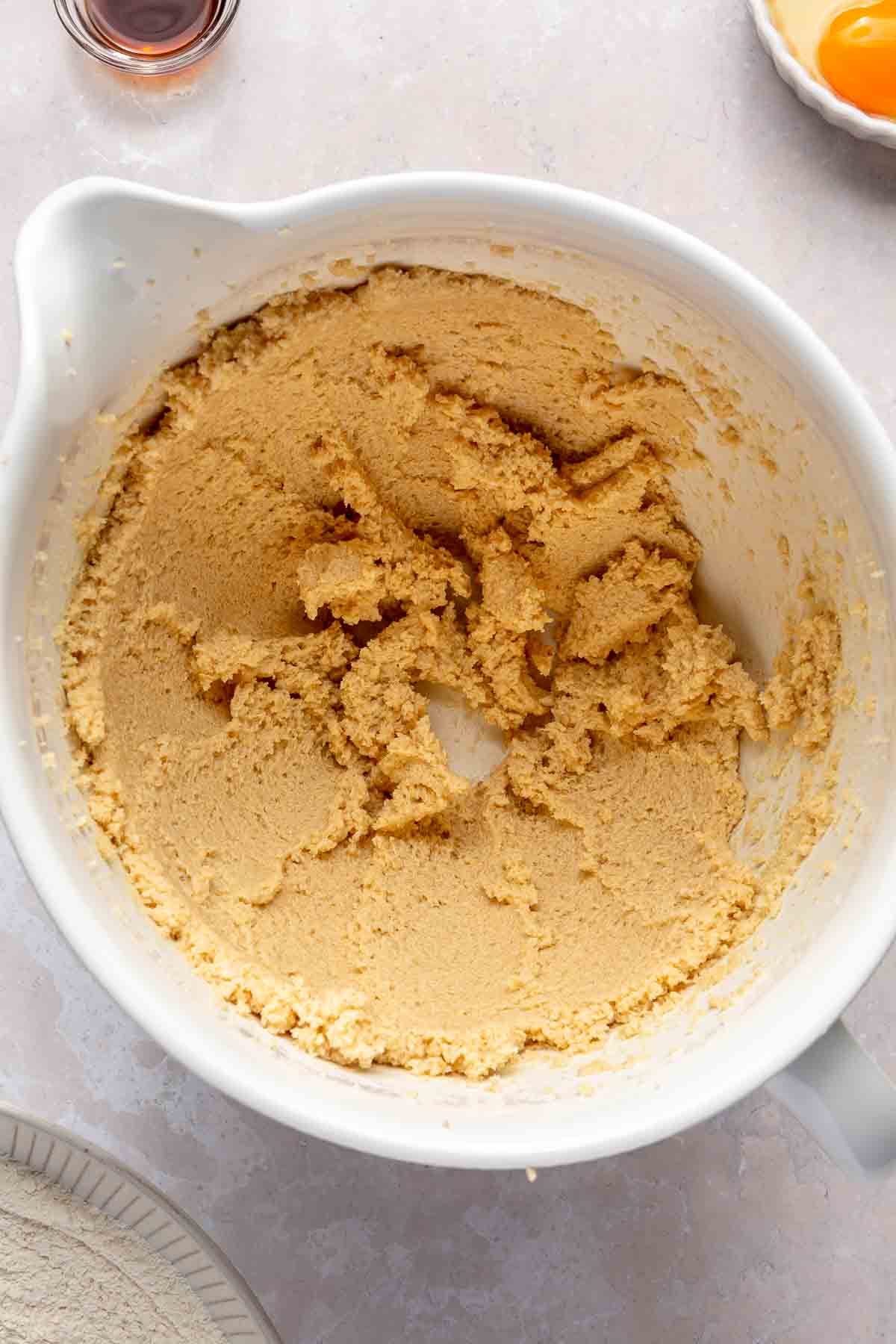 Butter and brown sugar mixed in a bowl.