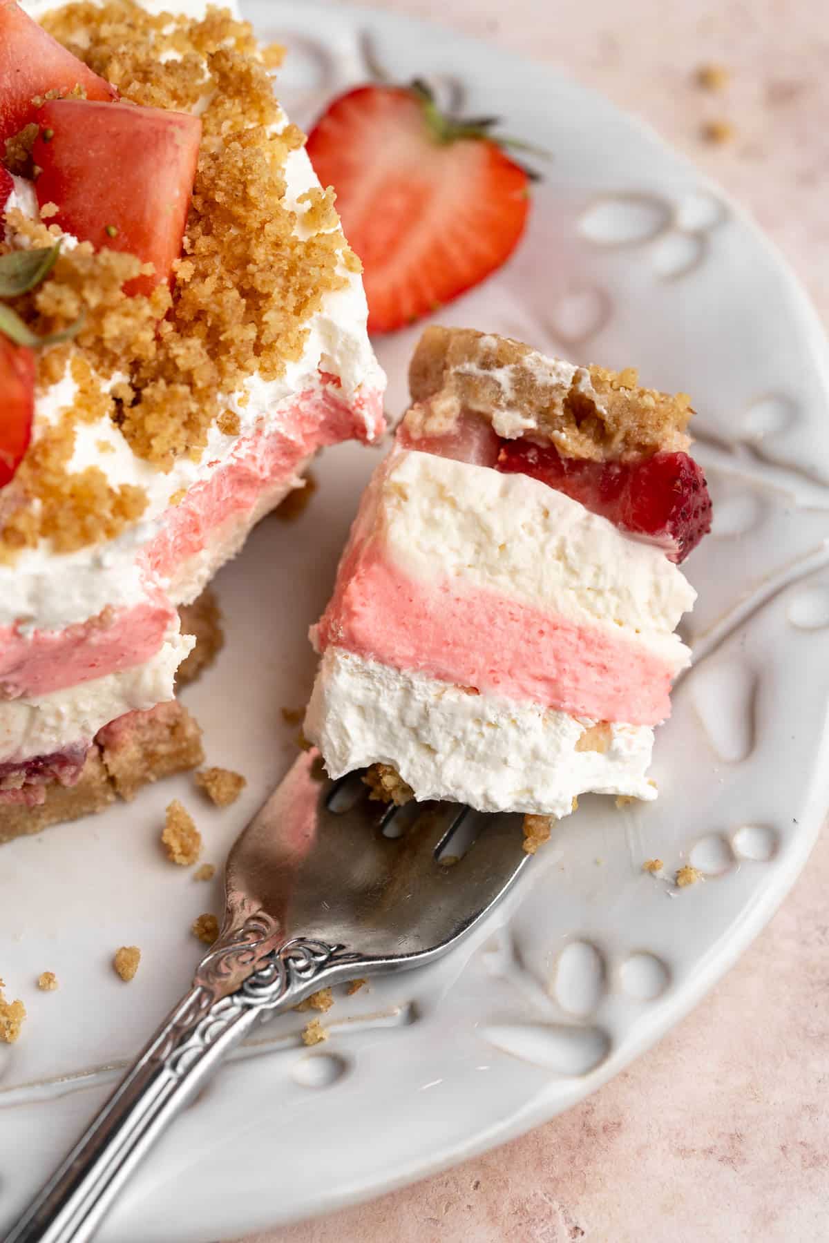 Bite of strawberry delight on a fork.