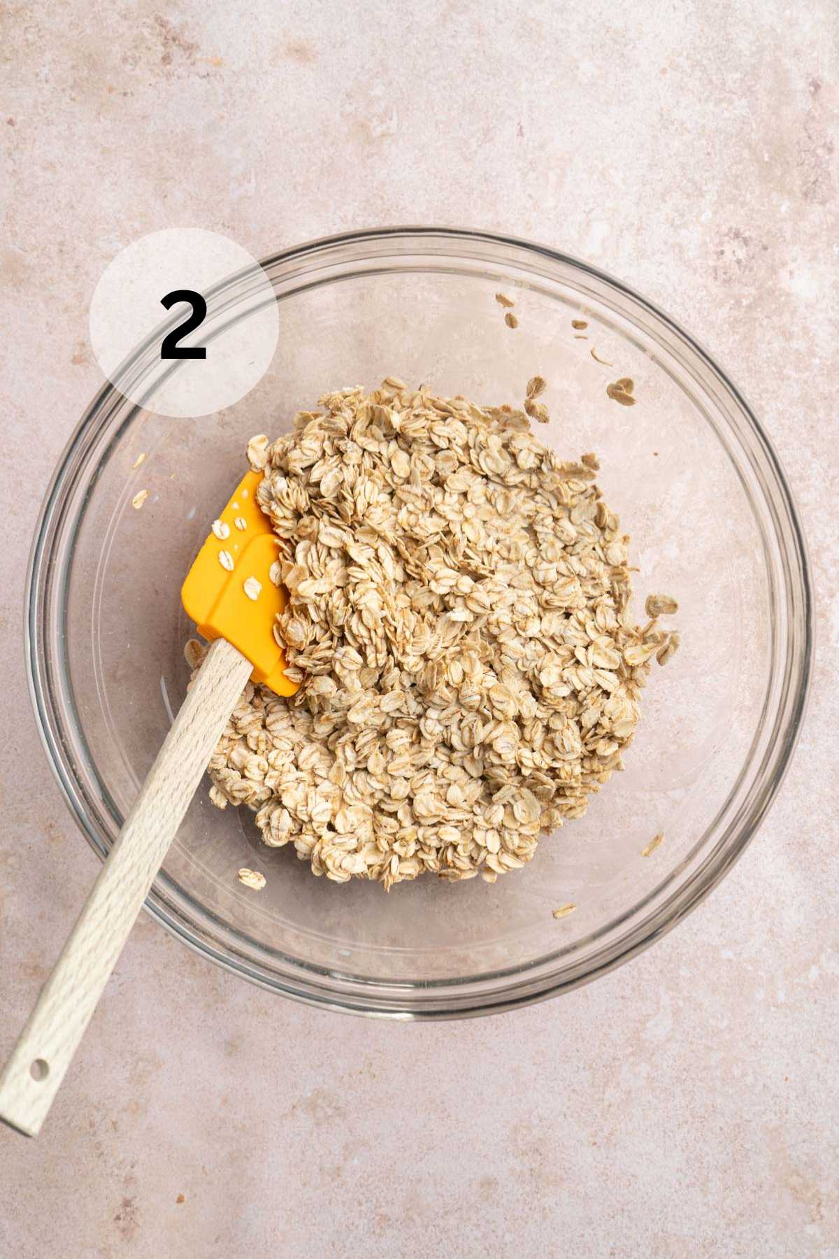 Stirring milk and oats together in a medium bowl.