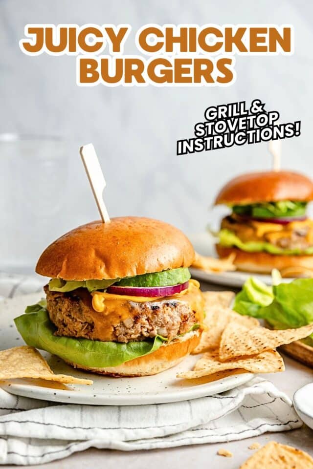 Chicken burgers with avocado, onion and lettuce.