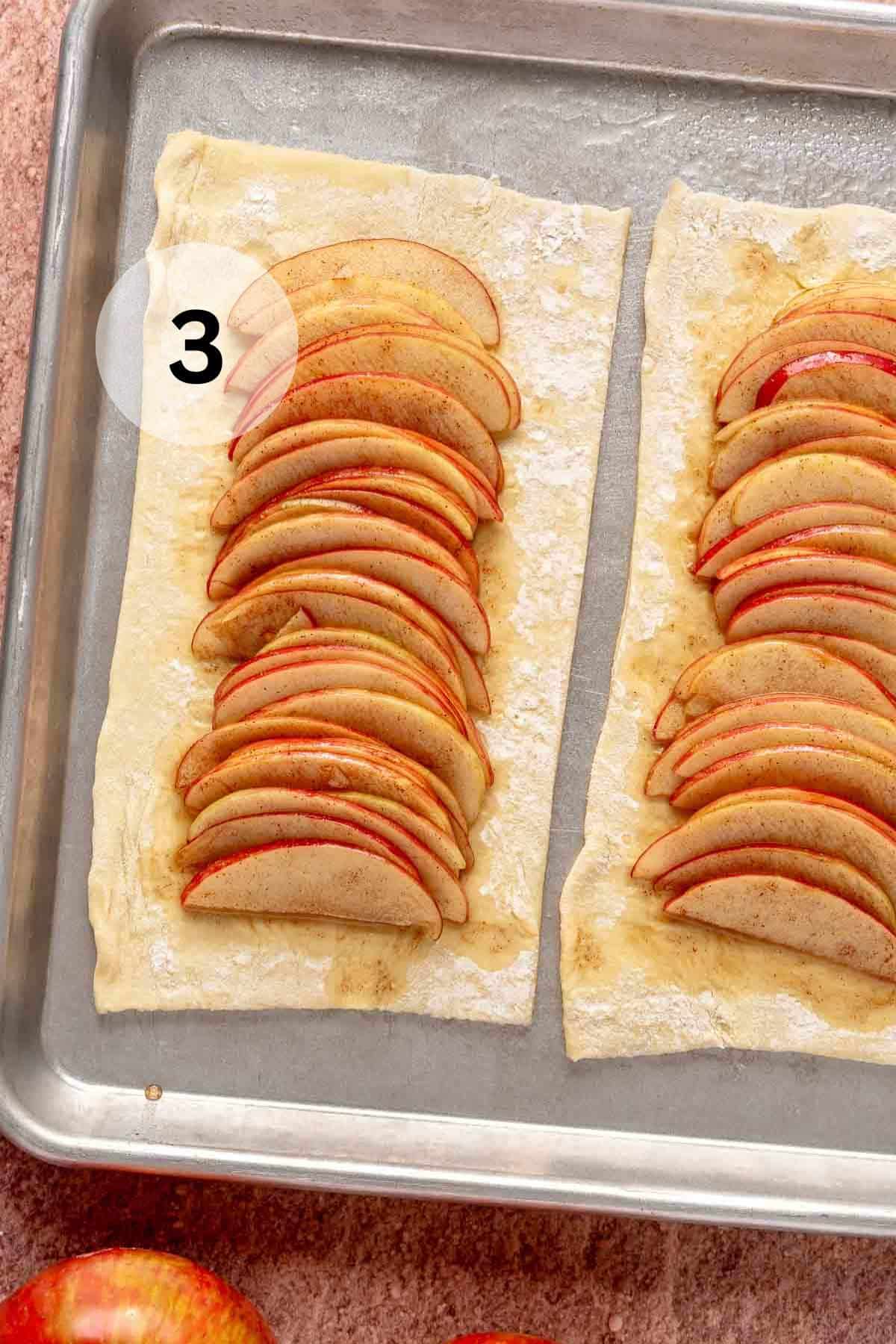 Sliced apples layered on puff pastry dough.
