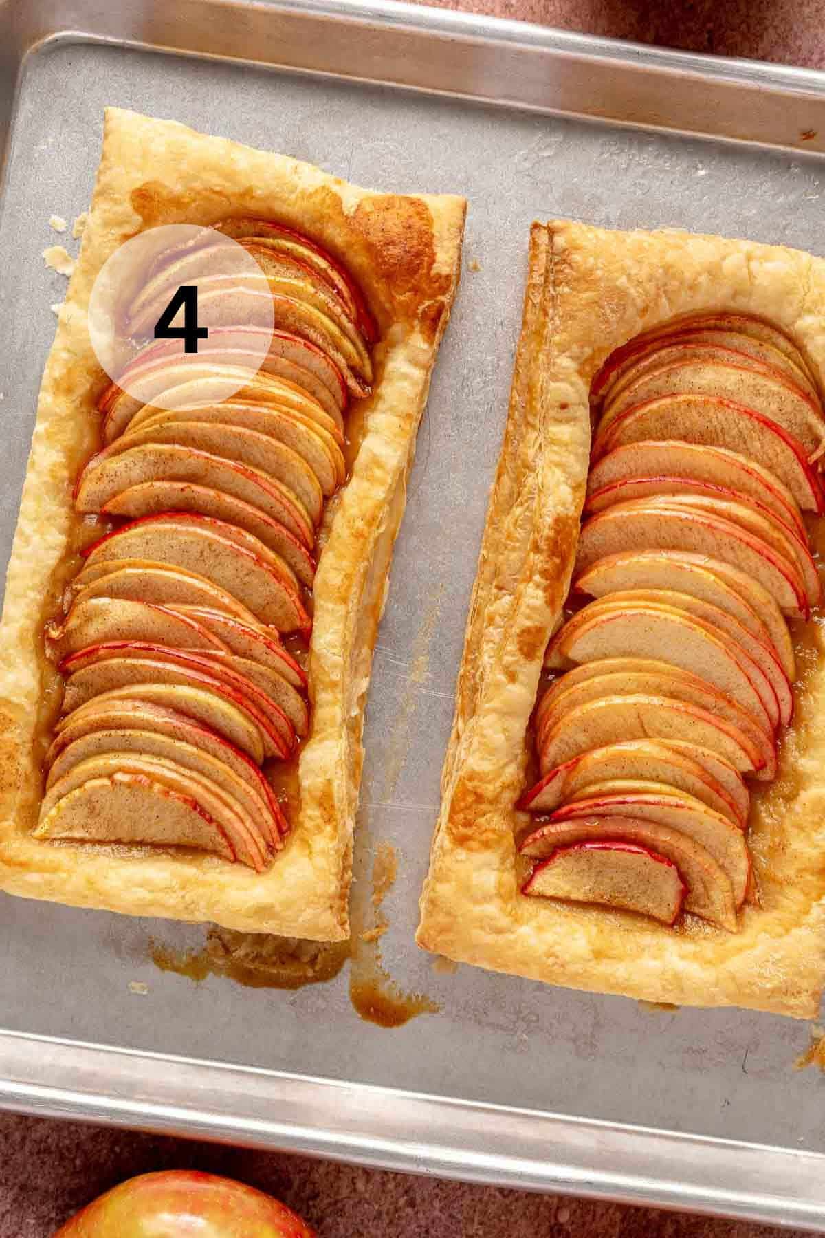 Baked apple tarts on a sheet pan.