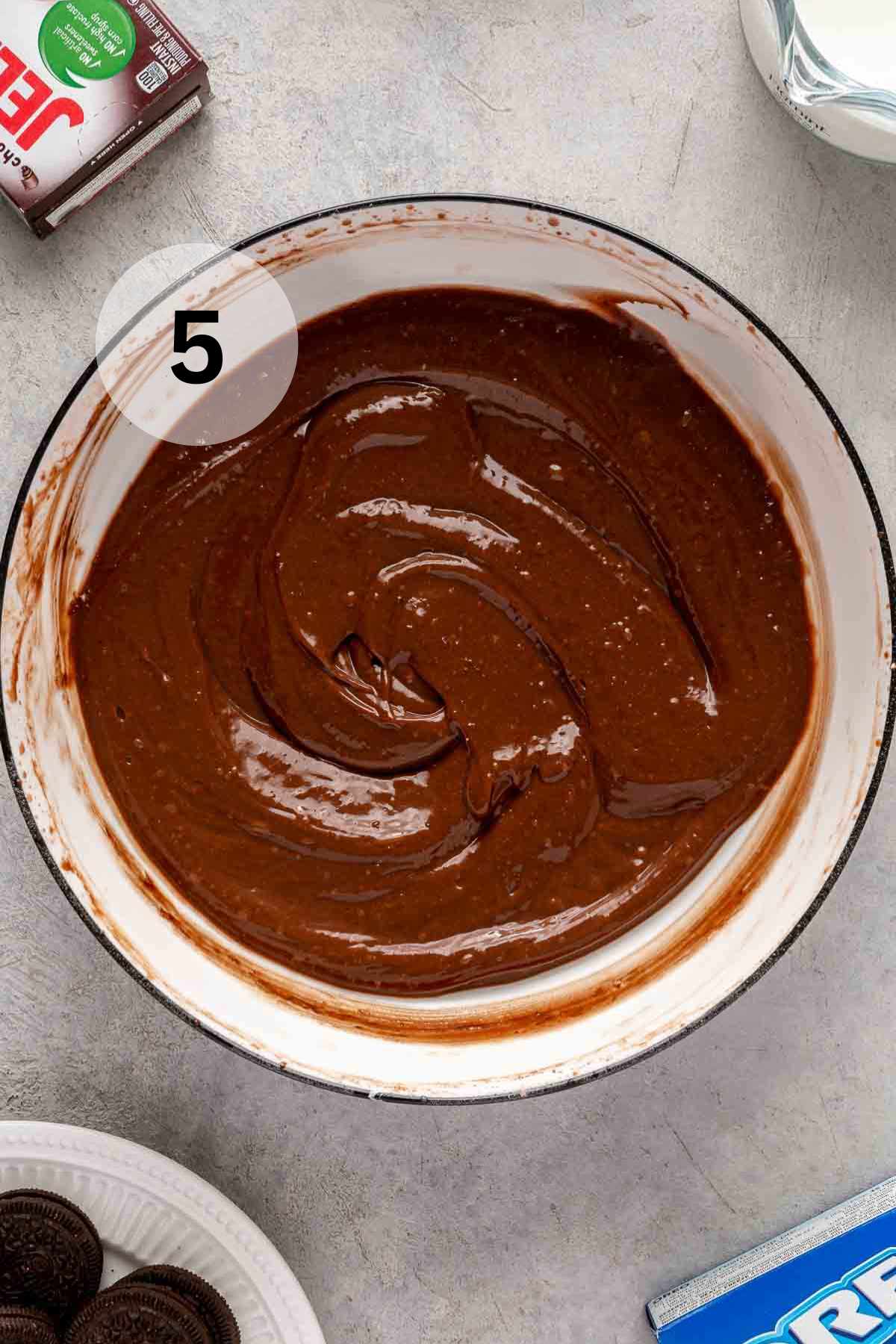Chocolate pudding in a white bowl.