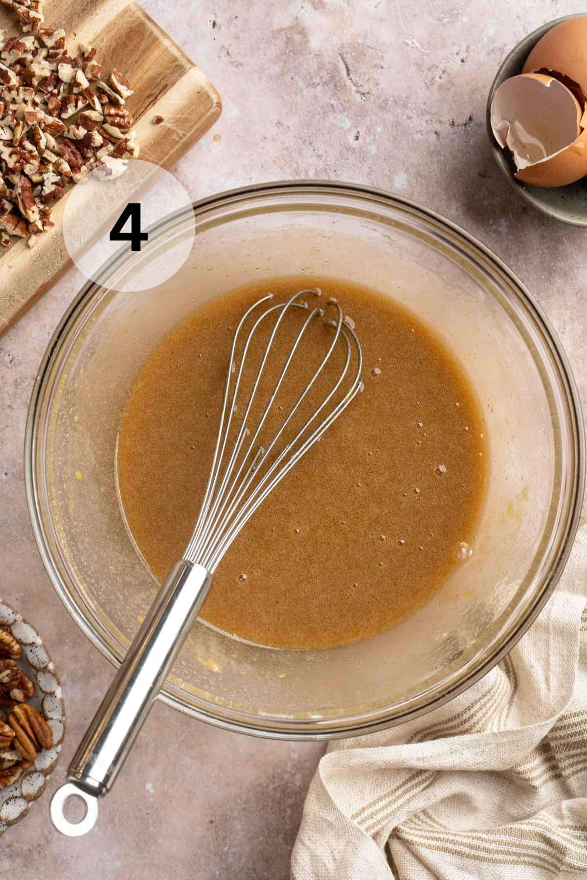 Whisking eggs, brown sugar, vanilla and flour in a large bowl.