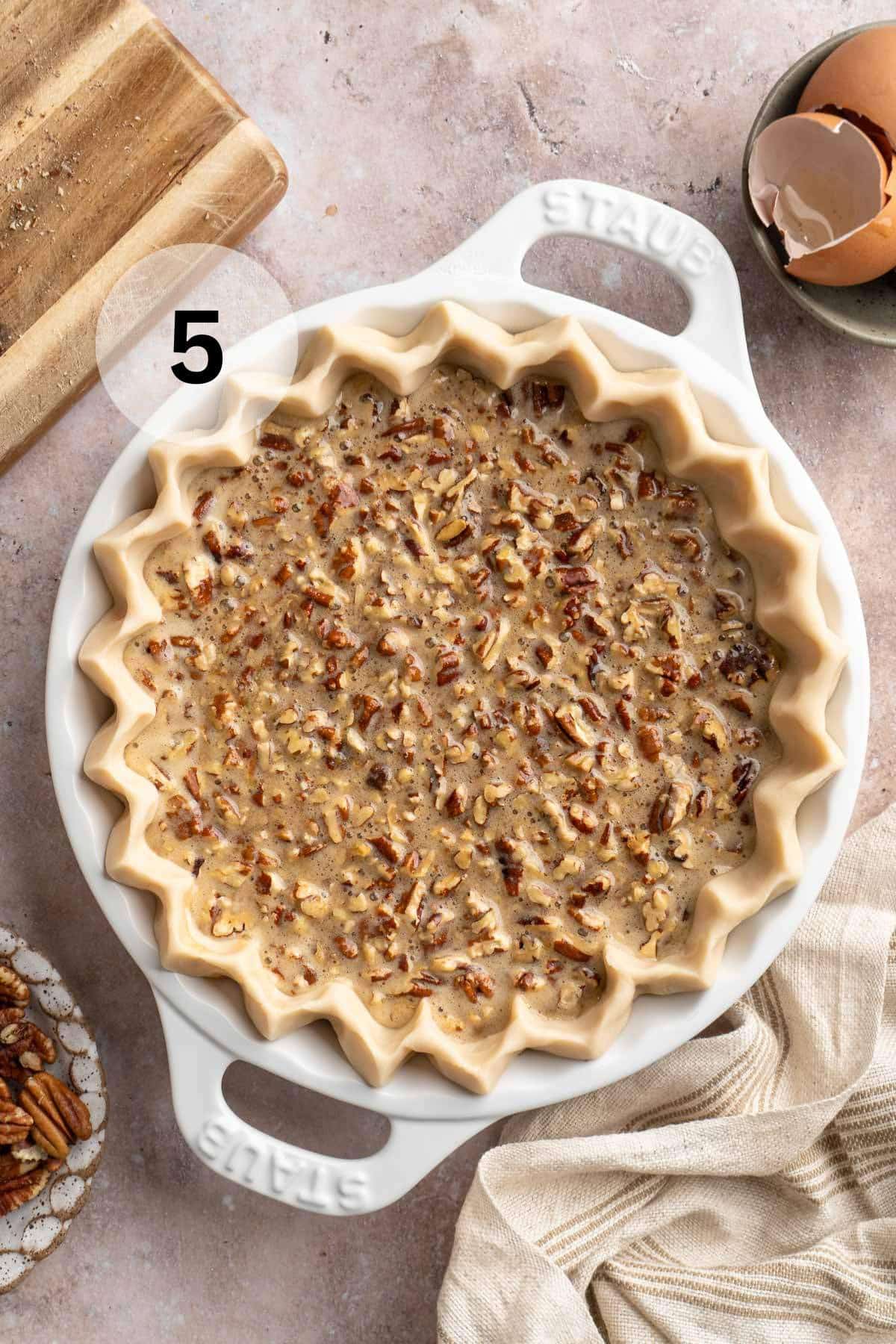 Pecan filling in a pie crust.