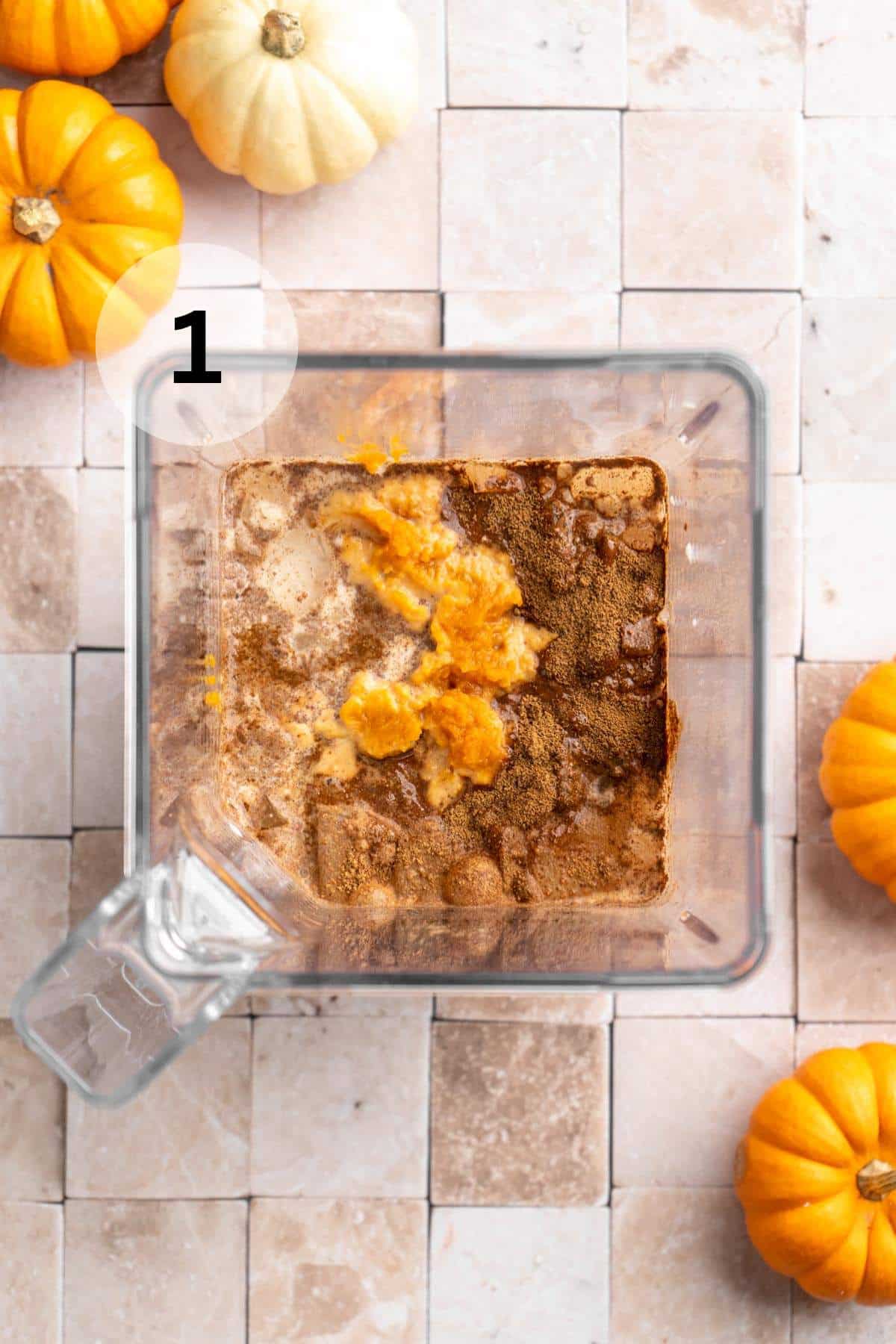 Pumpkin, milk, maple syrup, vanilla and spices in a blender.