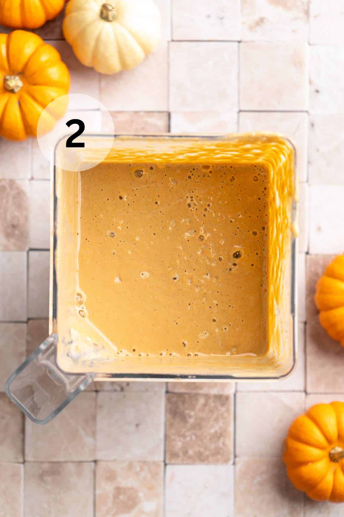 Blended pumpkin drink in a blender.