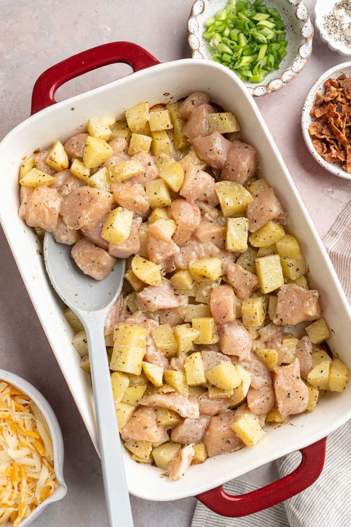 Stirring chicken with roasted potatoes.