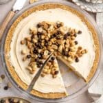 No bake peanut butter pie topped with peanuts, peanut butter chips and chocolate chips.
