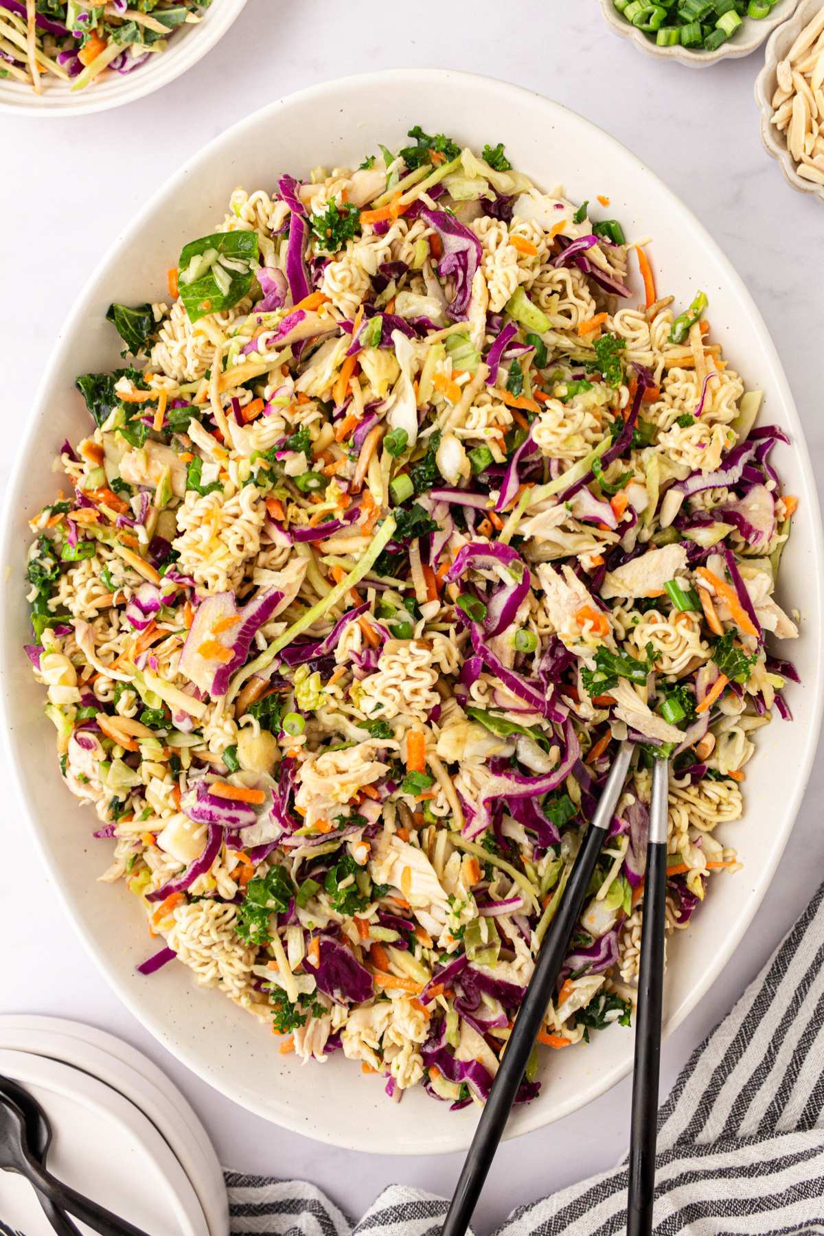 Ramen noodle salad on a large white serving platter.