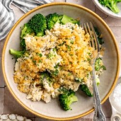 Poppy seed chicken served in a bowl with broccoli.