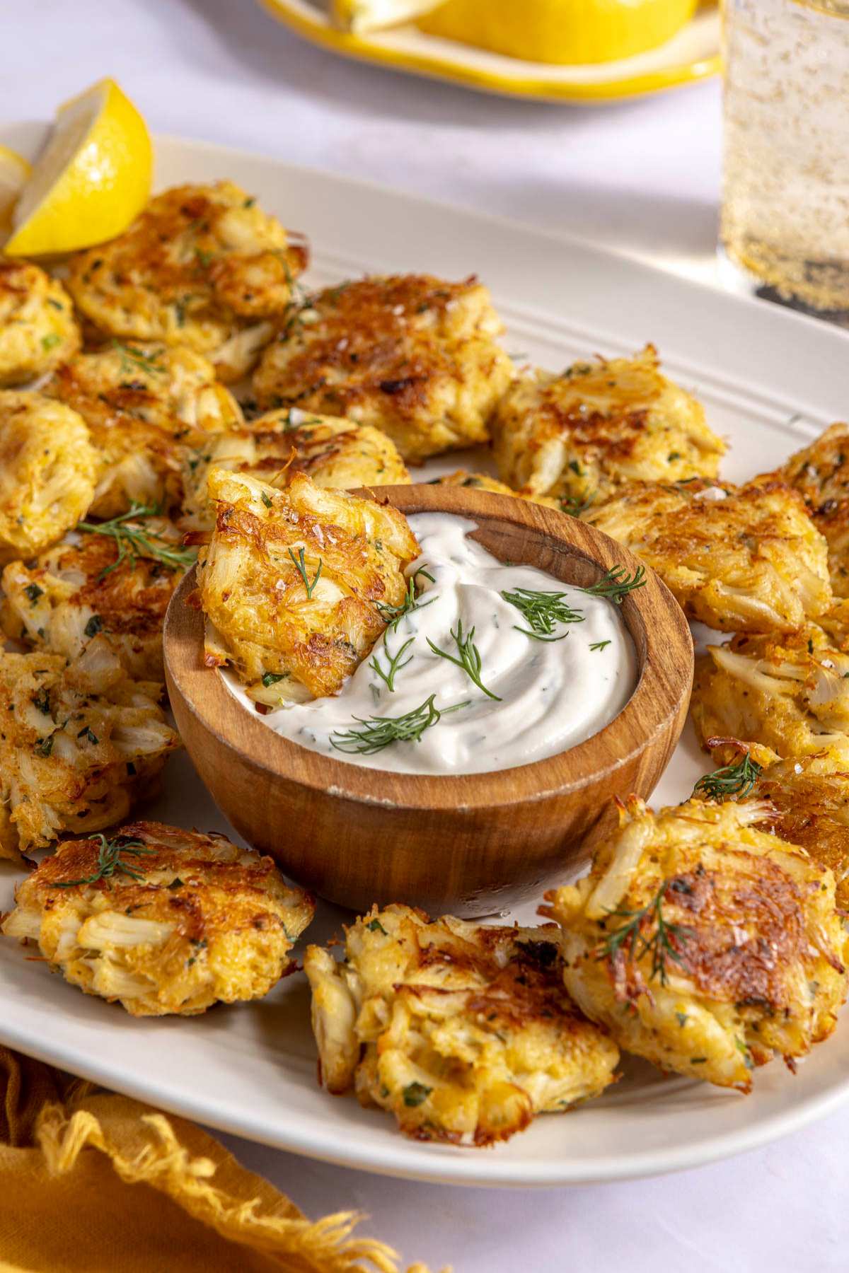 Crab cake dipped into lemon dill sauce.