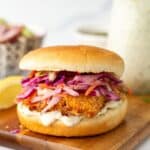Fish sandwiches with coleslaw and tartar sauce.