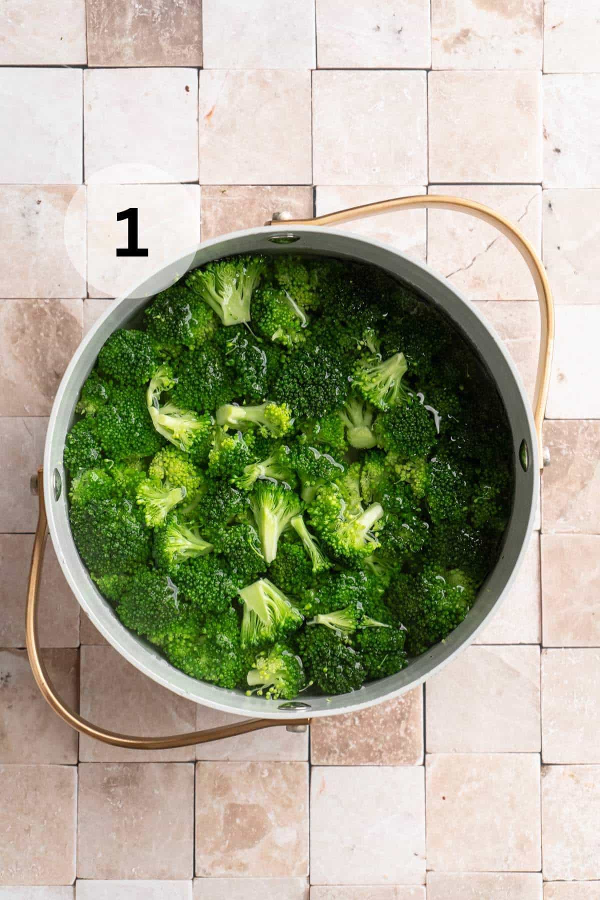 Cooking broccoli in a pot of water.