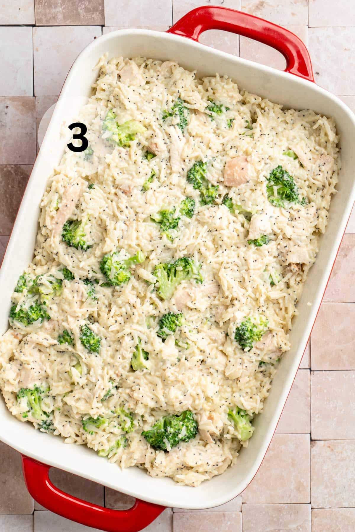 Chicken, broccoli and rice mixture spread into a casserole dish.