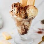 Tiramisu ice cream served in a dessert glass with lady fingers.