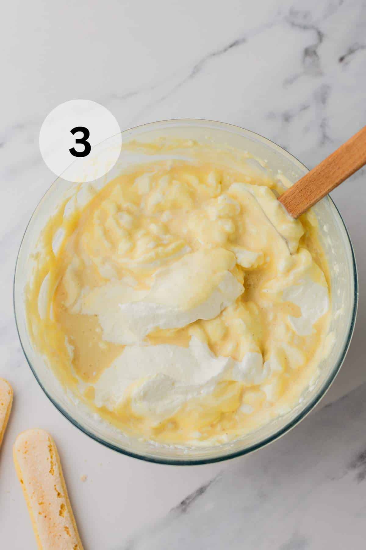 Gently fold the whipped cream into the mascarpone mixture until fully combined and fluffy.