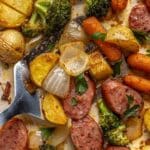 One pan meal with sausage, carrots, broccoli and potatoes.