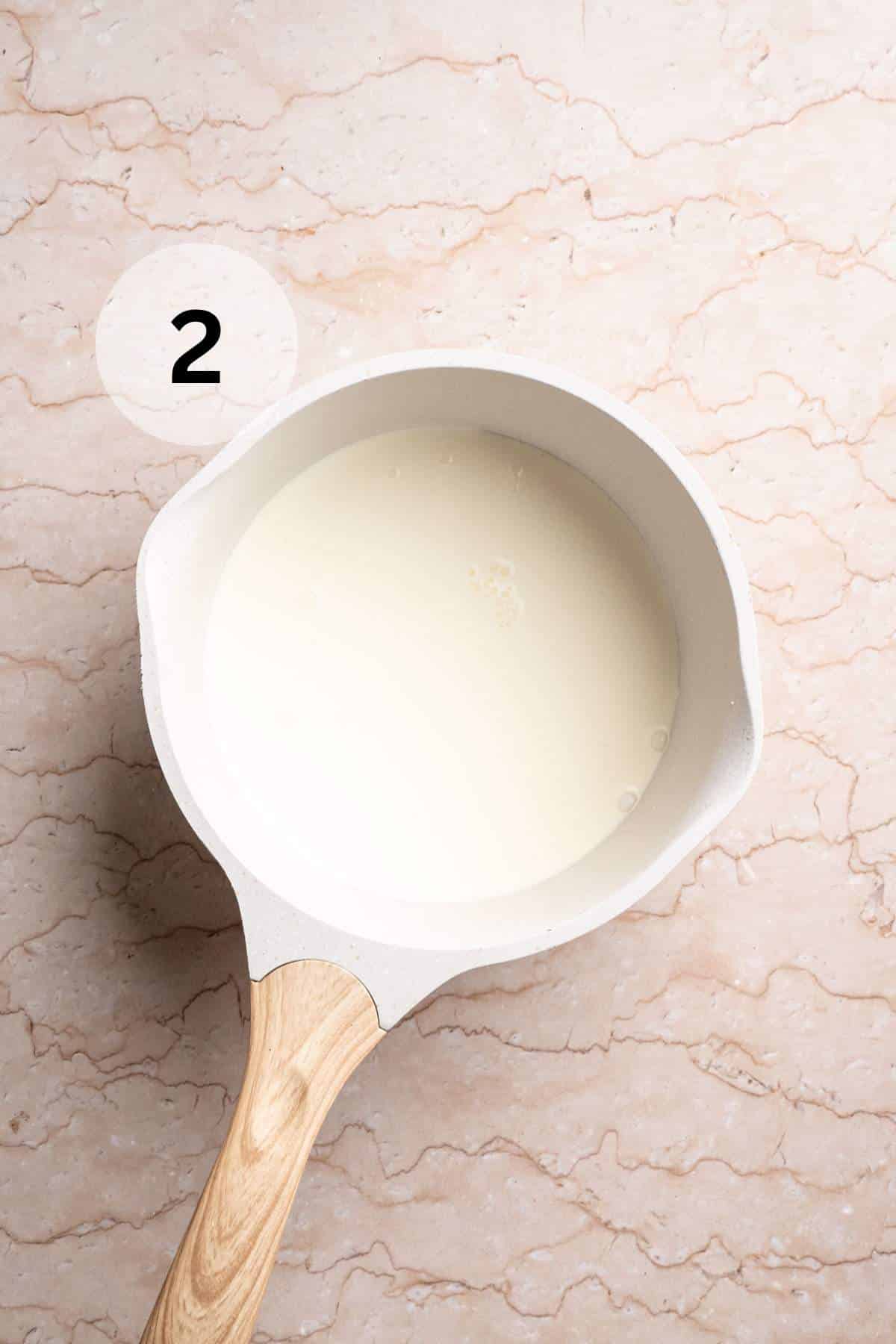 Cream in a small saucepan.