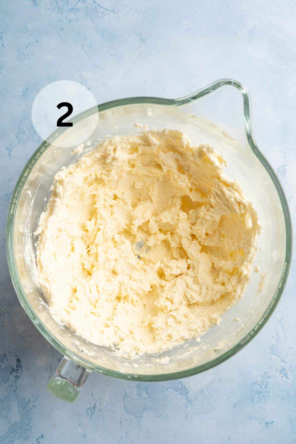 Butter and sugar creamed together in a bowl.