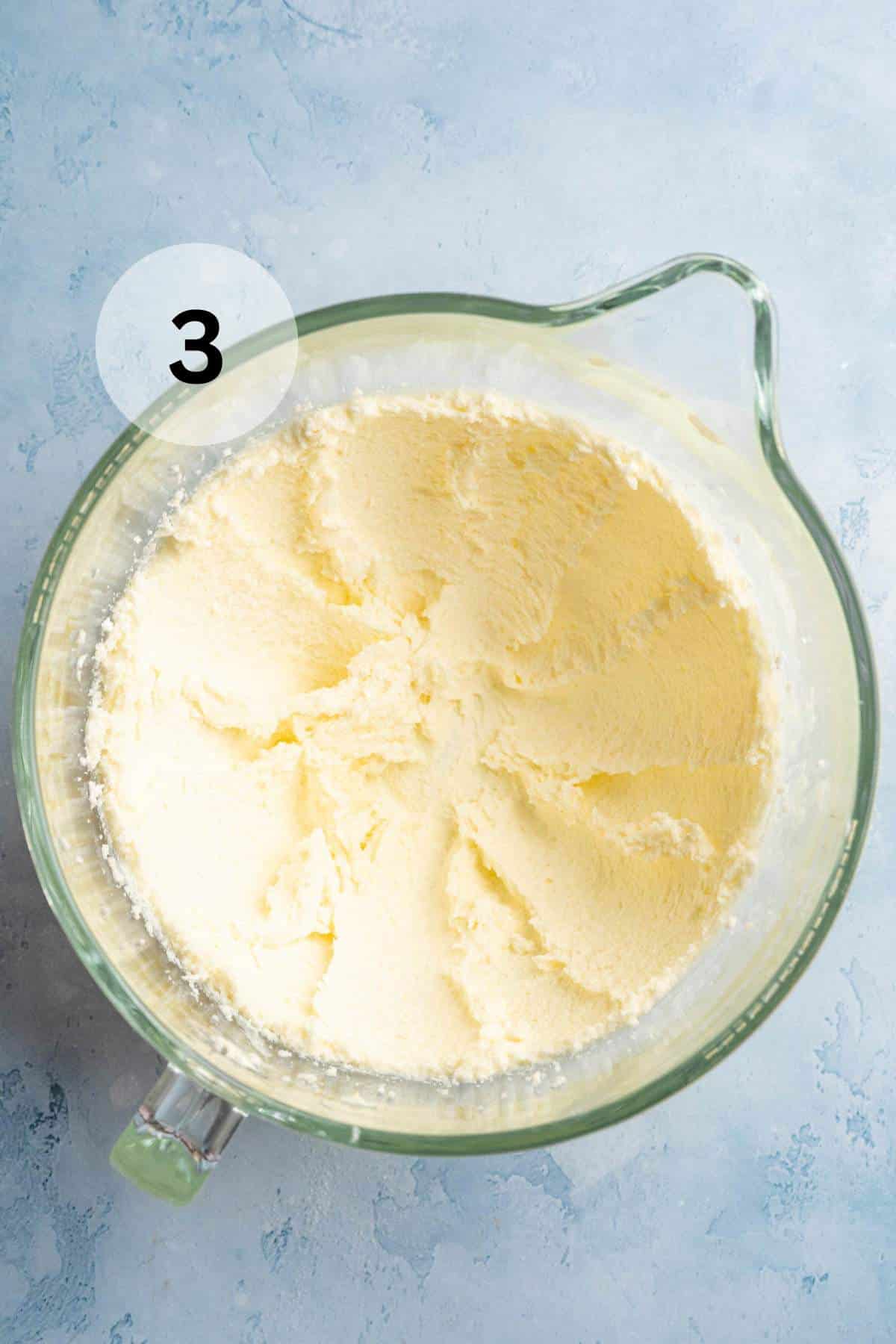 Mixing egg and vanilla into cookie dough.