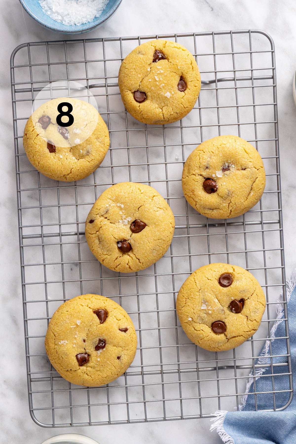 Small batch chocolate chip cookies on a wire rack.