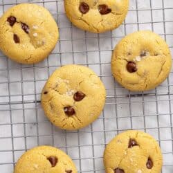Chocolate chip cookies on a wire rack.