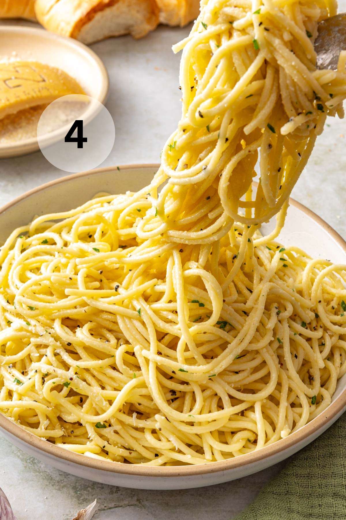 Adding buttered noodles to a bowl.
