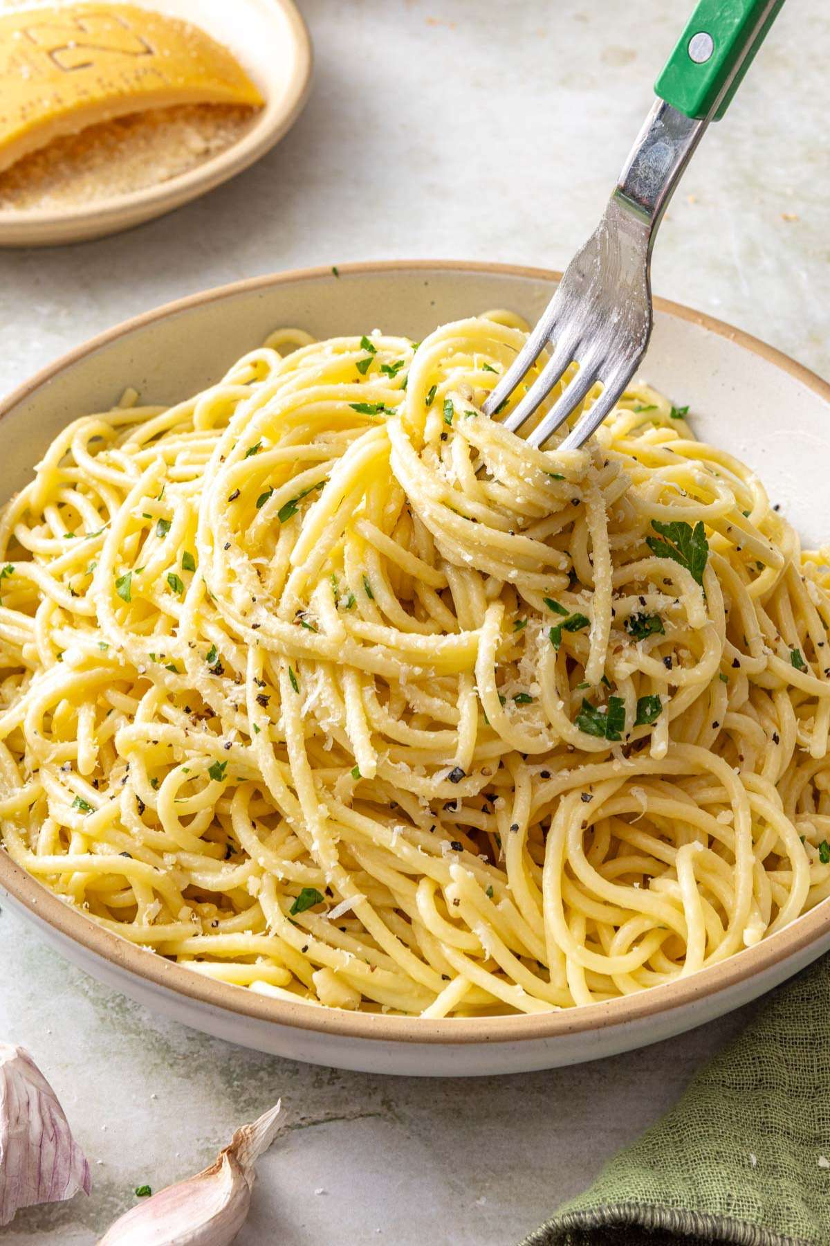 Fork swirling spaghetti noodles around it.