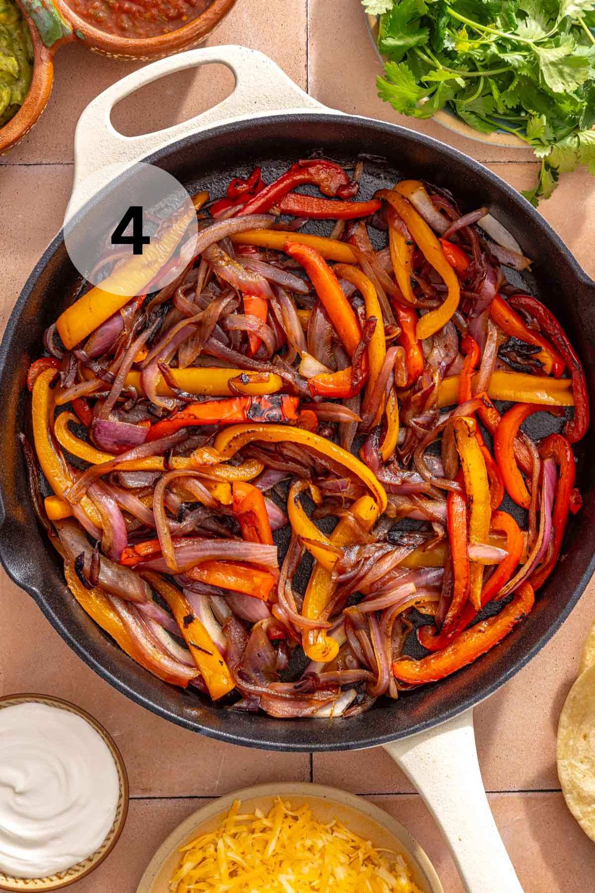 Sautéed veggies in a skillet.
