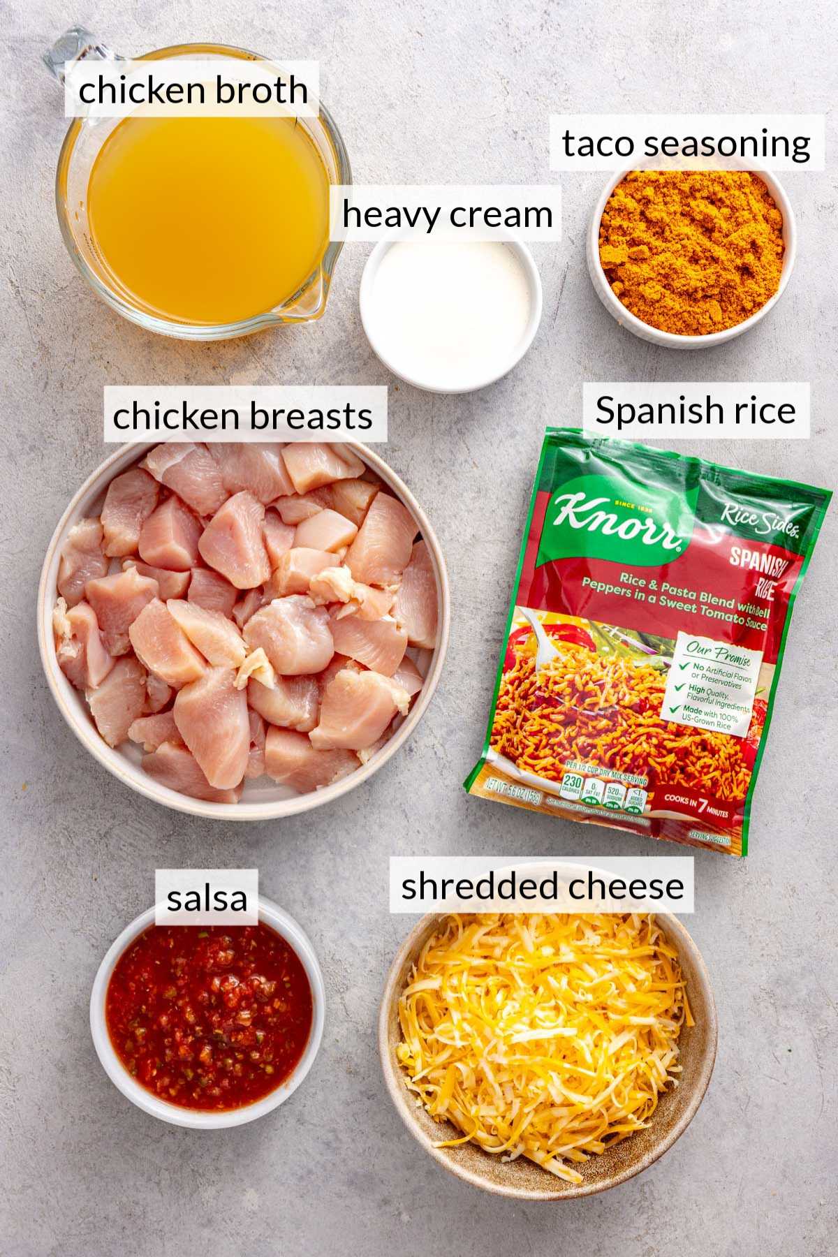 Rice packet, raw chicken, shredded cheese, chicken broth and salsa.