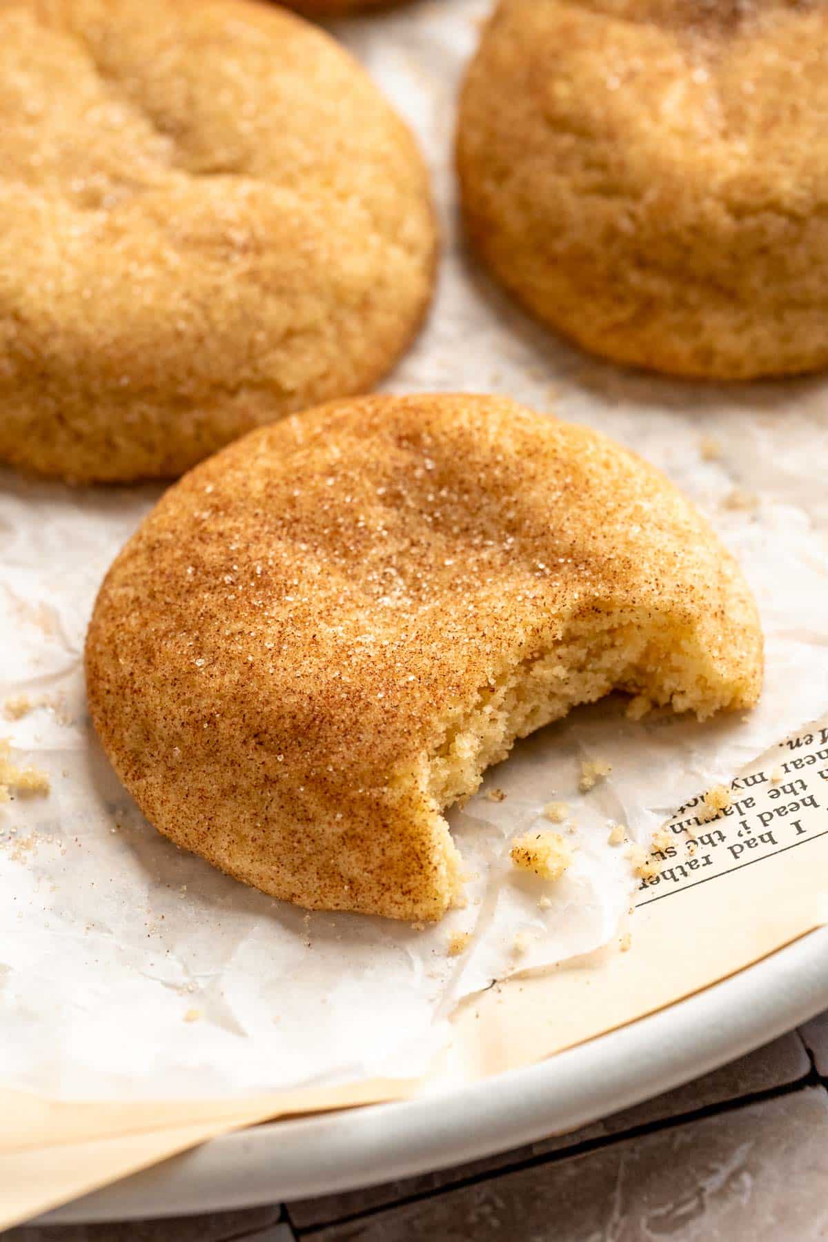 Snickerdoodle cookie with a bite taken out.