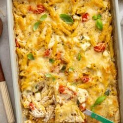 Scooping out a serving of chicken pasta bake.