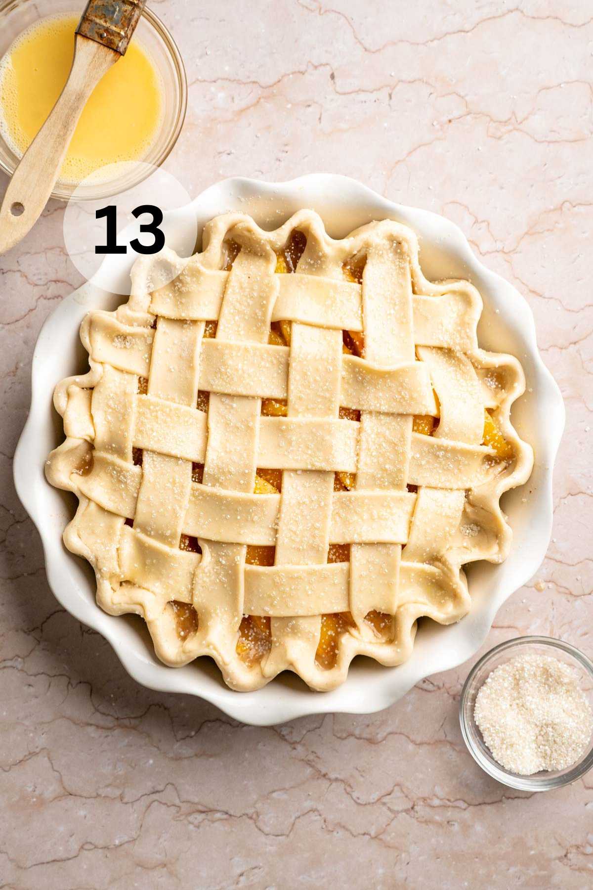 Peach pie with a lattice crust before being baked.