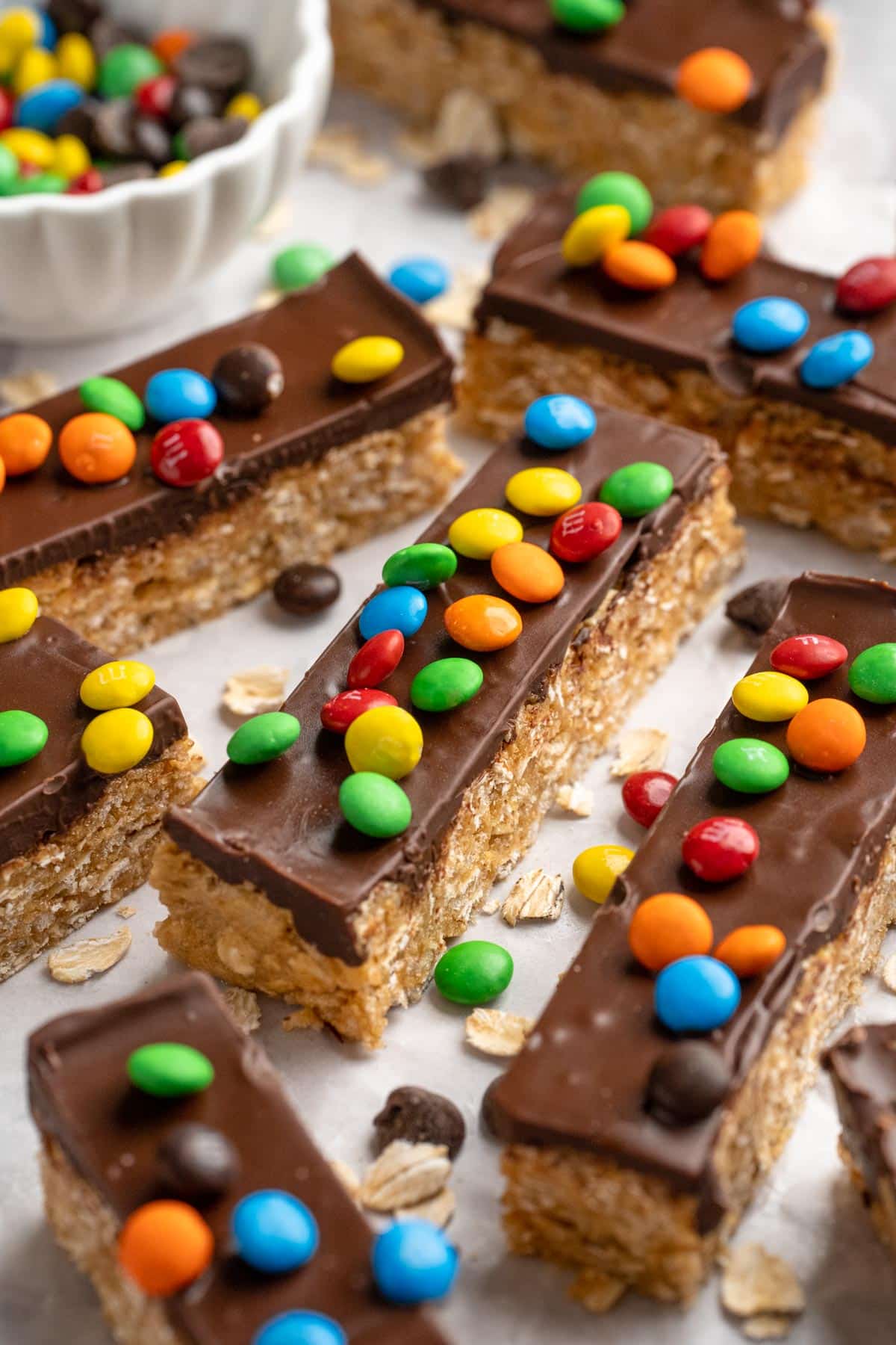 Rectangular protein bars topped with chocolate and M&M's.