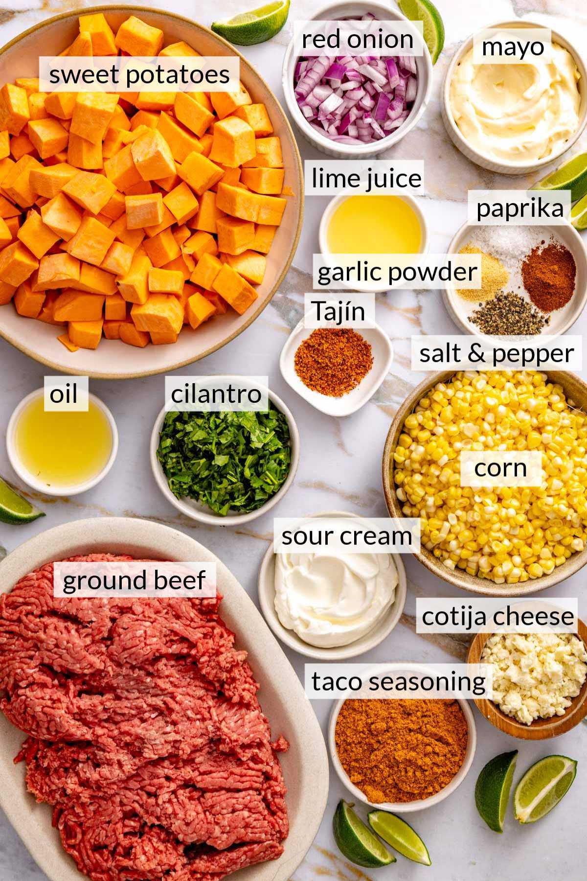 Bowls with ground beef, sweet potatoes, corn, onion and spices.