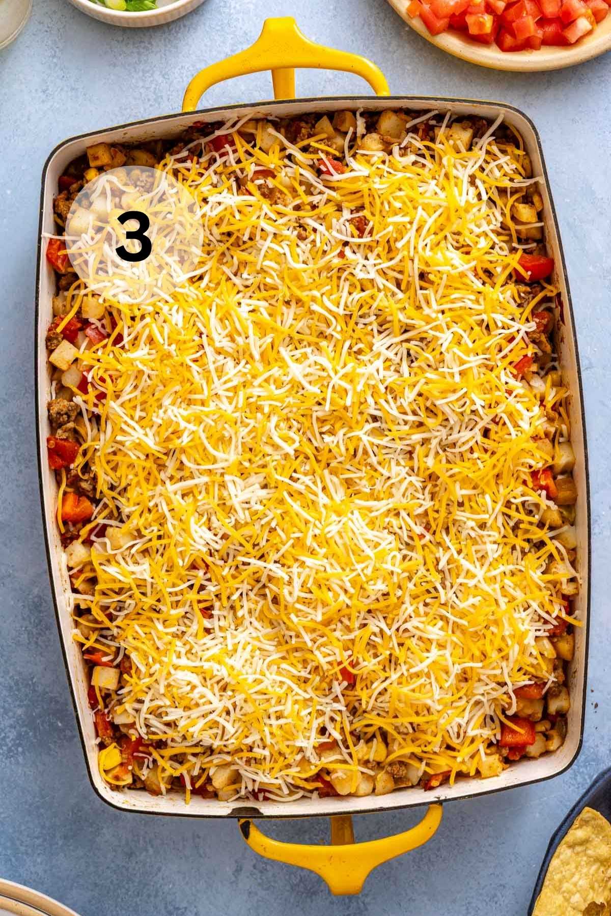 Shredded cheese sprinkled over casserole.