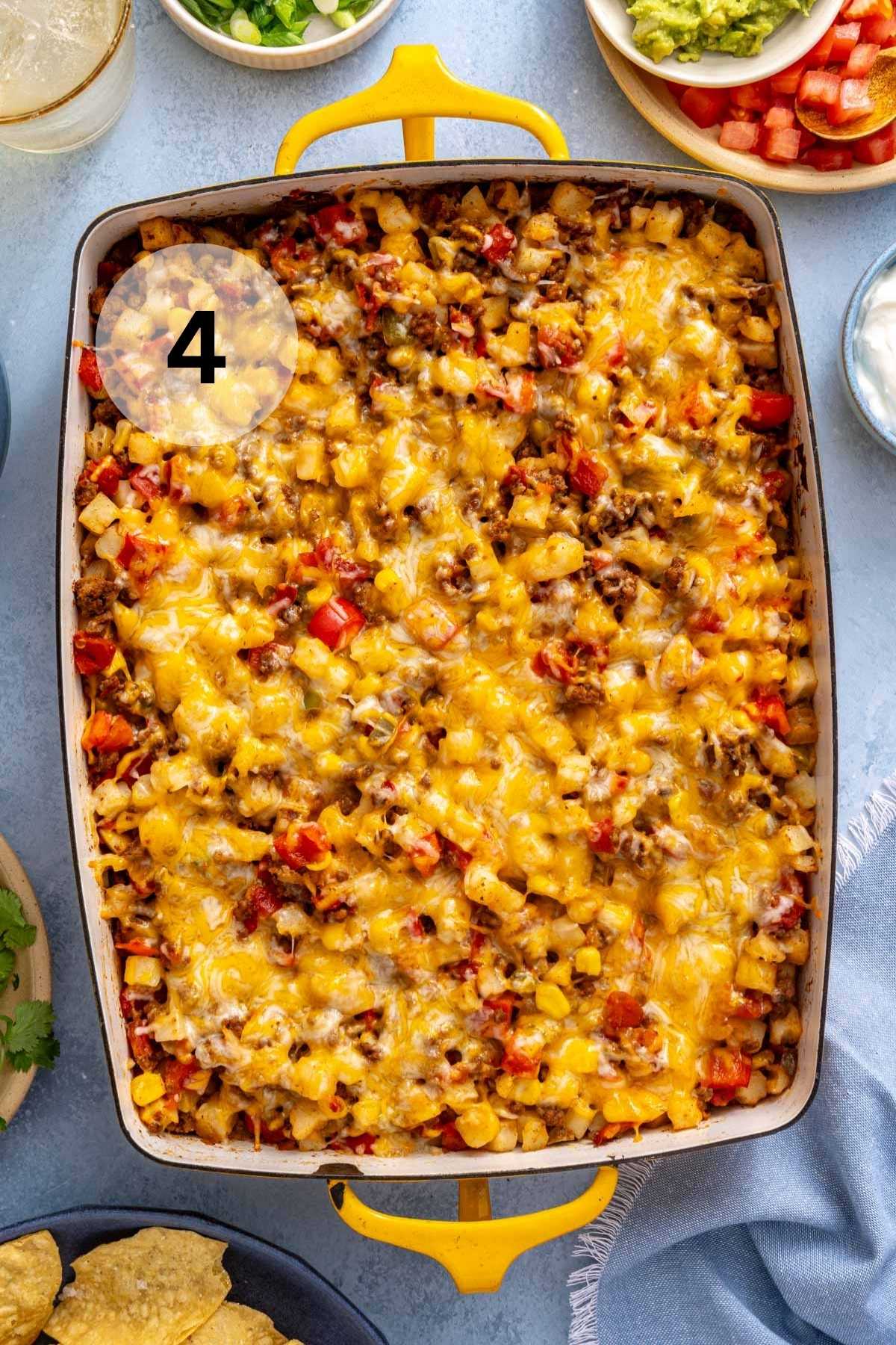 Baked taco potatoes topped with melted cheese.